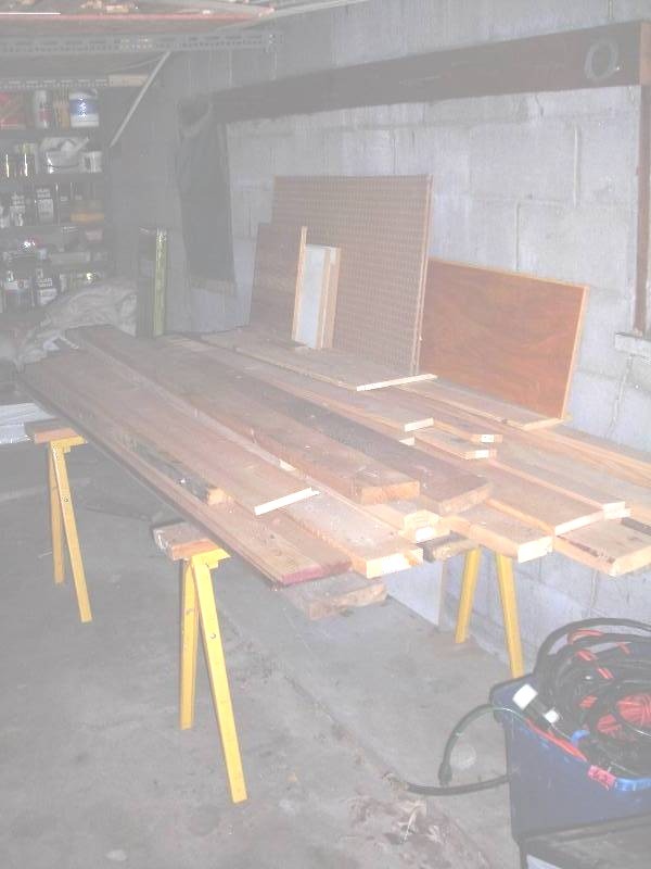 lot 168 image: 2-Piles Of Lumber (Hanging From Ceiling & On Saw Horses Which Are Included)