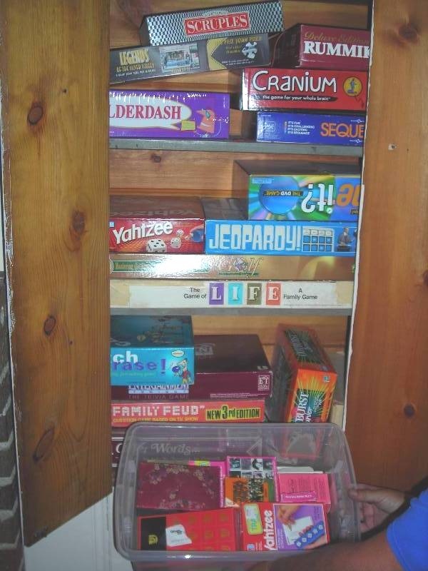 lot 220 image: Cupboard & Tote FULL Of Games (Bring Boxes)