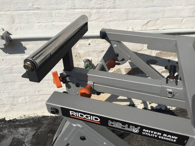 lot 1 image: Dewalt 12 saw on a Ridgid saw stand
