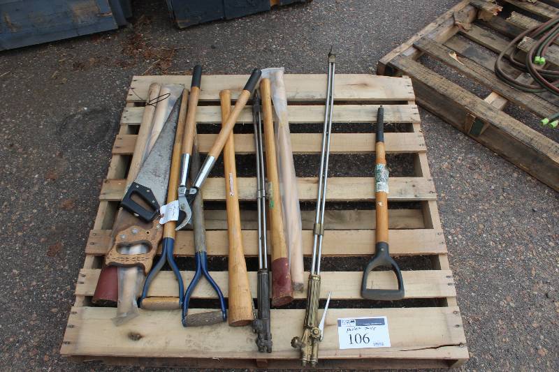 Pallet Of Tools Including Shovel Handles Saws Hedge Trimmer And More.