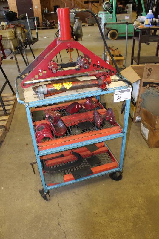 lot 38 image: Metal Cart Lot Including Dayton Pipe Bender, Complete with Metal Clamps, Hardware Metal Cart wWheels & Two Lower Shelves 34 x 25 x 60.