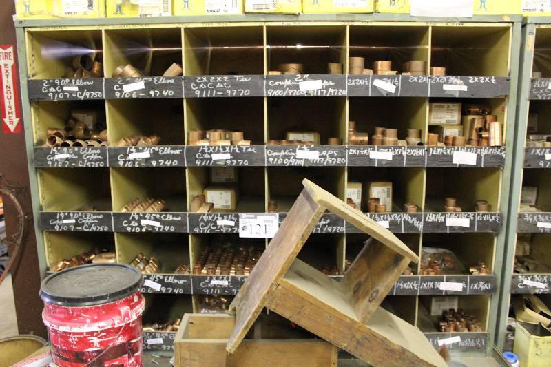 lot 121 image: Storage Shelf wMultiple Compartments & Contents 90 Degree Elbows Copper 45 Degree Elbows Copper And More 70 x 43 x 75.