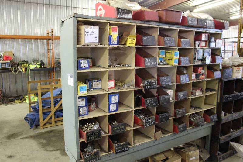 lot 115 image: Storage Shelf wMultiple Compartments & Contents 2 Long Drive Screws, Bolts, Drop-In Anchors, And More 81 x 14.5 x 74.