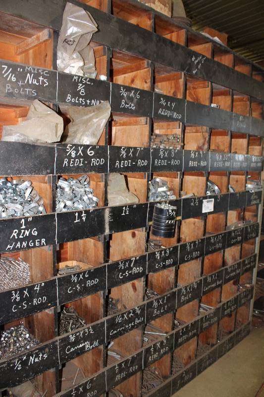 lot 110 image: Storage Shelf wMultiple Compartments & Contents Carriage Bolts, Red-Rods, C-S Rods, Ring Hangers, And More 96 x 13 x 98.