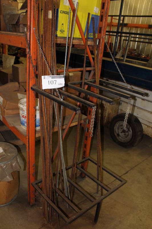 lot 107 image: Metal Stand wLower Shelf & Upper Bars For Metal Bars Includes Contents.