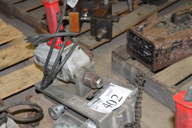 lot 402 image: The Hole Thing 12 Drill & Track Kit.
