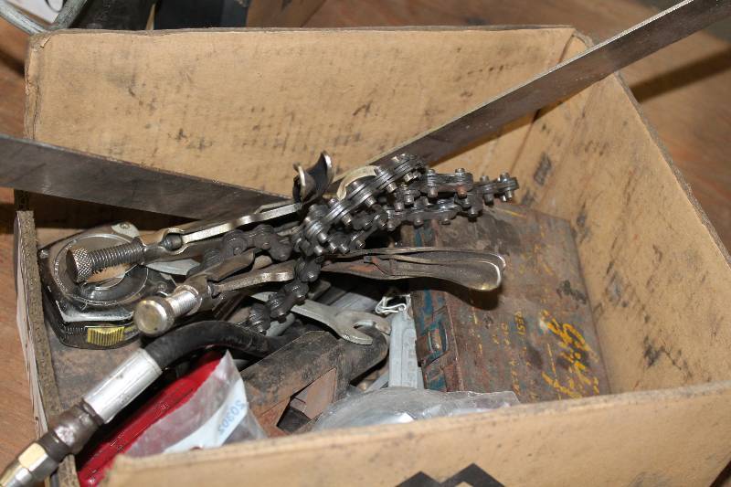 lot 304 image: Box Lot of Tools Including Crest Jiffy Kick Rubber Ball Cock Wash Metal Grips Chain And More.