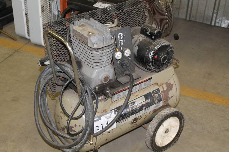 lot 314 image: Sears Craftsman 1HP Air Compressor wGrate Guard & Wheels.