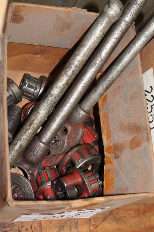 lot 397 image: Box Lot Including Ridgid Dies Metal Bars wPipe Fitting Ends Die Wrench And More.