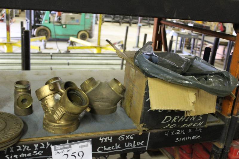 lot 259 image: Shelf Lot Including 4 x 4 Check Valves 6 x 6 Check Valves Box of Breaker Caps And More.