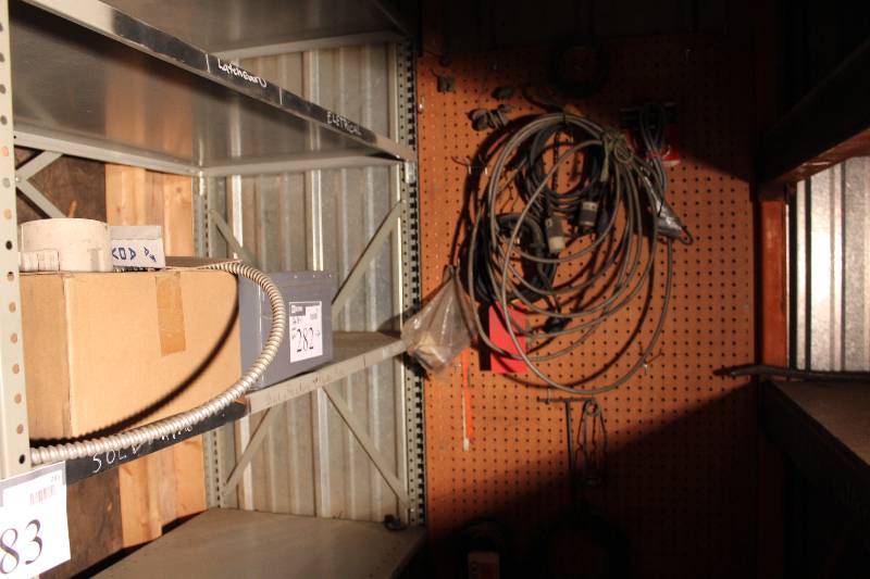 lot 282 image: Wall Lot Including Miscellaneous Belts Extension Cords Miscellaneous Hardware And More.
