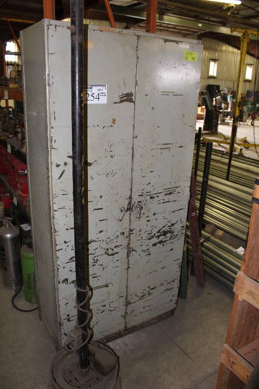 lot 254 image: Metal Cabinet wDouble Doors & Shelves Includes Contents Rustoleum Paints Spray Paints Epoxy Solvent And More 19 x 36 x 75.