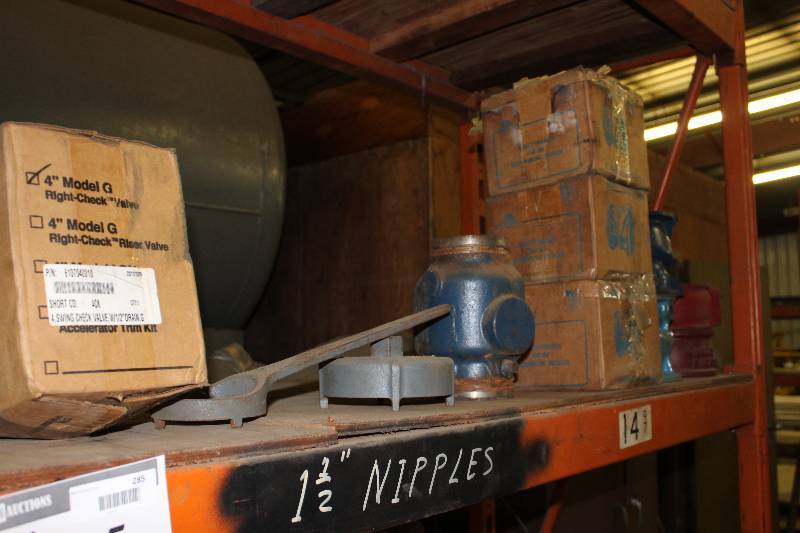 lot 285 image: Contents of (2) Shelves Including 1.5 Nipples Swing Check Valve And More.