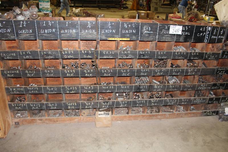 lot 248 image: Storage Shelf Lot Including Storage Shelf, 8.5 x 96 x 48 Metal Union Connectors, Multiple Sizes Bush Fittings Plugs Caps And More.
