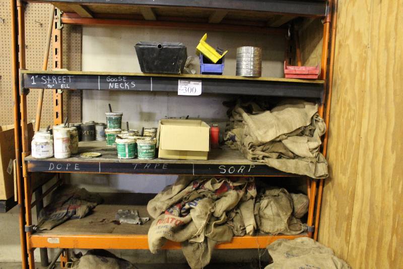 lot 300 image: Contents of Rack Including Burlap Sacks Plastic Containers And More.