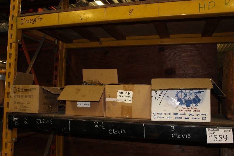 lot 559 image: Shelf Lot Including Box of 3 Clevis Box of 2.5 Clevis Grooved Pipe Fittings And More.