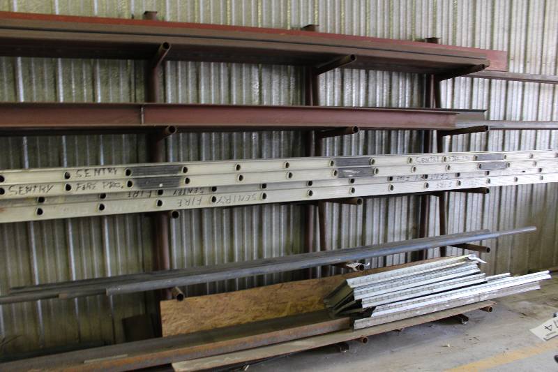 lot 580 image: Custom Metal Rack wMultiple Pole Shelves For Stacking Long Items 33 x 144 x 90.