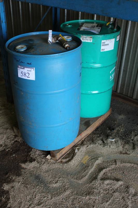 lot 582 image: Lot of (2) Plastic 30Gal Drums 50 Percent Mix Propylene Glycol (1) 17Gal Cuting Oil (1).