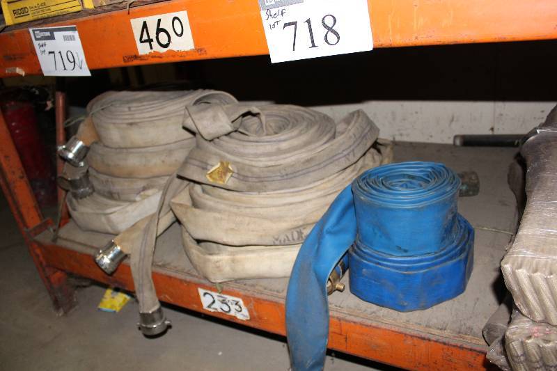 lot 718 image: Shelf Lot Including Fire Hoses Plastic Fire Hoses Garden Hose And More.
