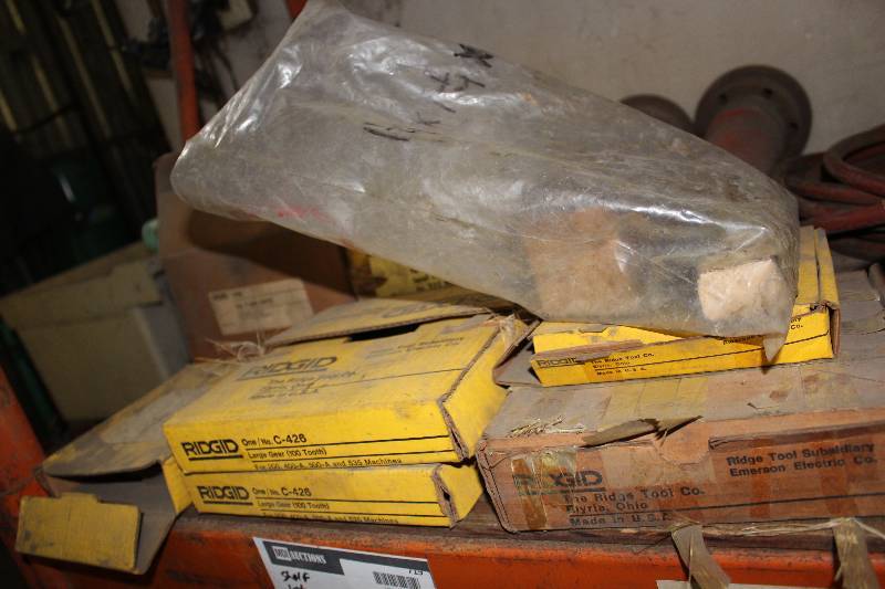 lot 719 image: Shelf Lot Including Ridgid Large Gear 100 Tooth Ridgid Field Assembly And More.