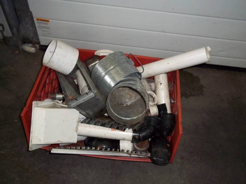 Assorted plumbing and duct work items with red bin