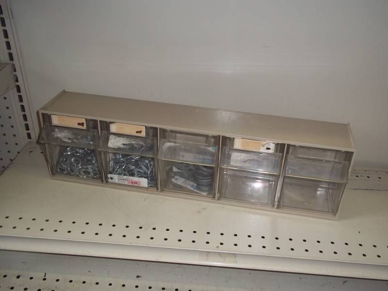 Parts bin with new electrical conduit nuts