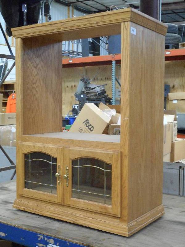 lot 45 image: Rolling Wooden T.V. Cabinet With Gl...