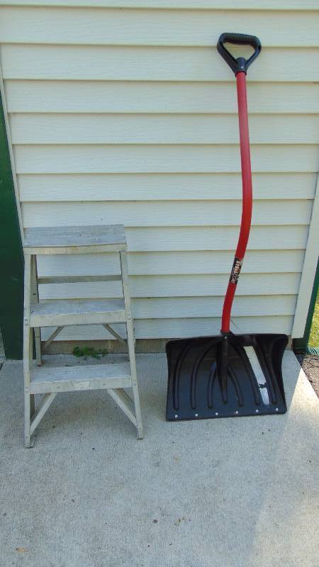 Shovel and metal step ladder