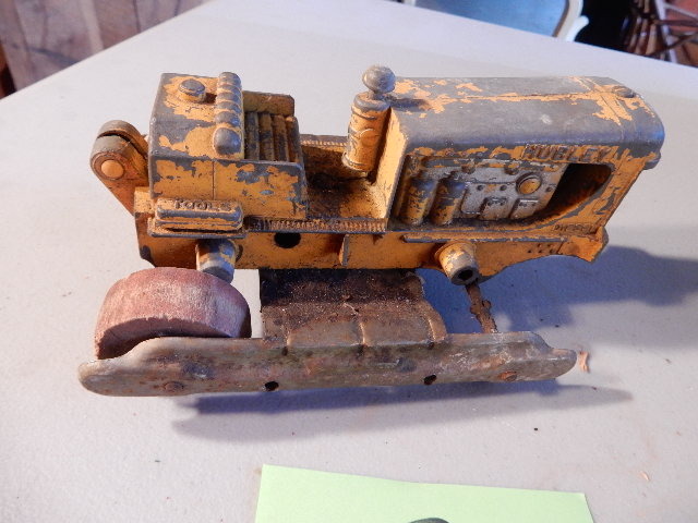 lot 52 image: HUBLEY Diesel Caterpillar with WOOD Wheels.. One wheel missing. Hubley Diesel, Road Grader, Missing front wheels