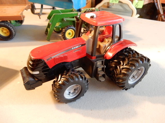 lot 69B image: John Deere Tractors.. 1 with bucket, 1 with no bucket.. John Deere hay wagon, Grain Wagon, Small Caterpillar, Case 305 Tractor, Utility Trailer.. All Small Scale.. Ave about 6 in length.