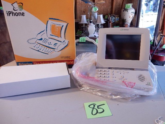 lot 85 image: INFO GEAR, iPhone.. Have fun with this one.. An antique to the tech world.
