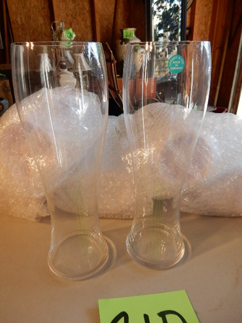lot 21D image: 8, 9 12 in tall, beer glasses.. Tiffany.. Only two unwrapped to photograph. Others in original Tiffany wrapping