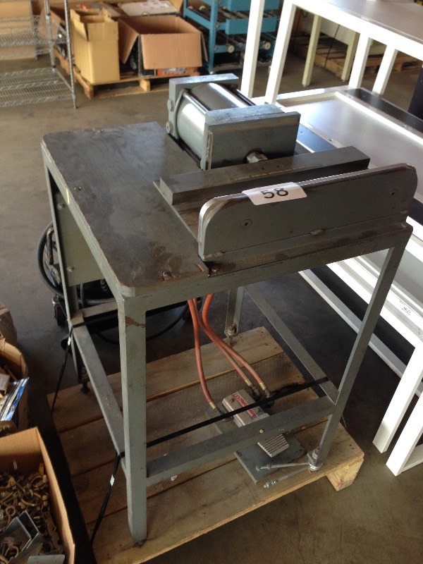 Foot operated press on metal table  stand