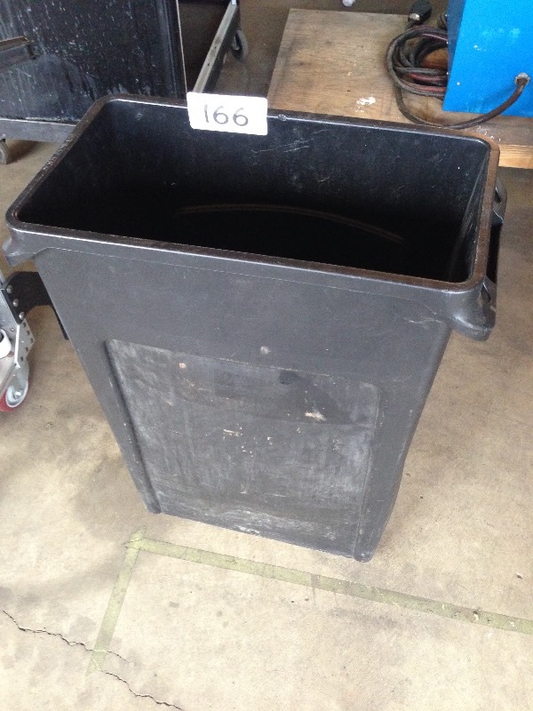 Rubbermaid trash can half full of regulators