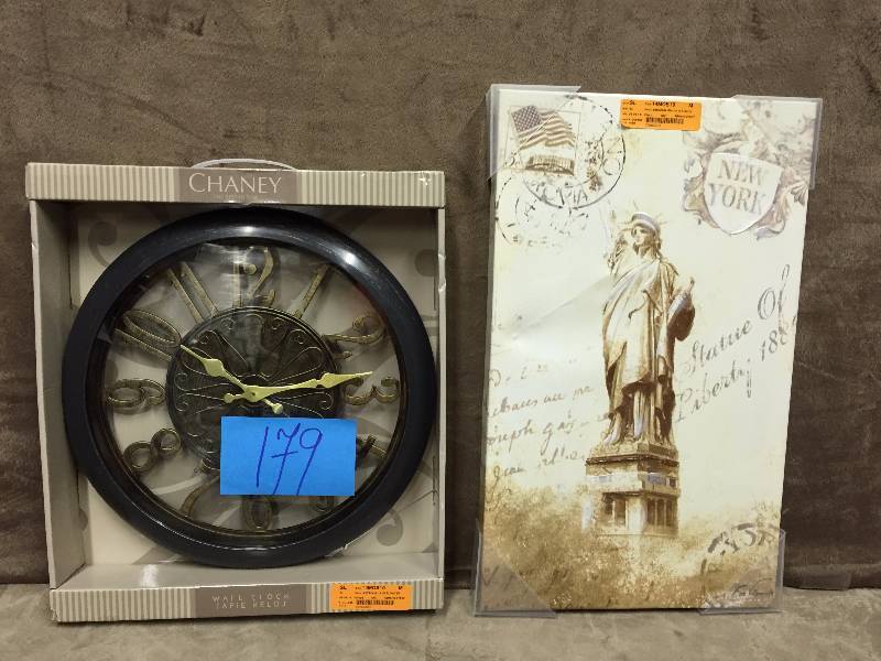 lot 179 image: Picture frame and clock