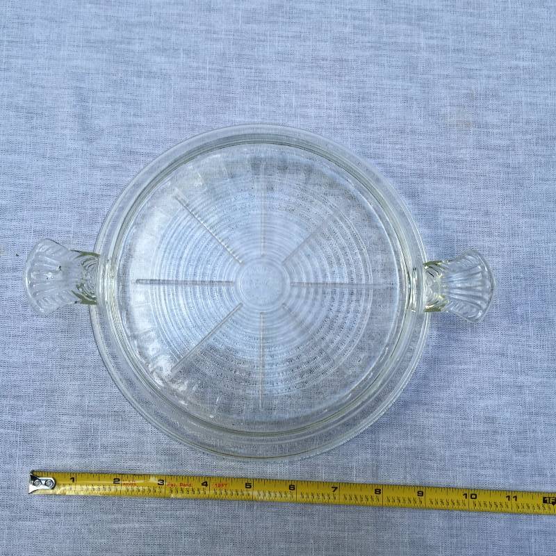lot 028 image: VINTAGE 1950s FIRE KING TRIVET HOT PLATE for casserole, pie CLEAR GLASS 2 TAB HANDLES ovenware