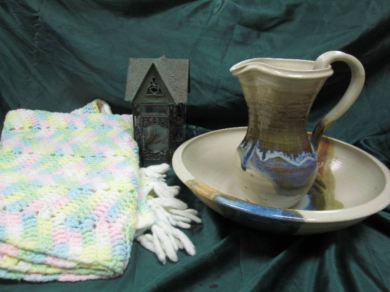 Homemade blanket, water pitcher and...