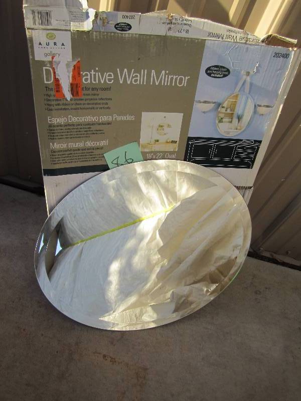 lot 86 image: 18 x 22 beveled edge oval mirror...