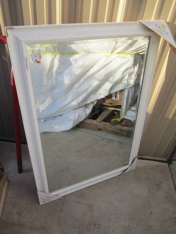 lot 89 image: 29 x 41 mirror, one chipped corner...
