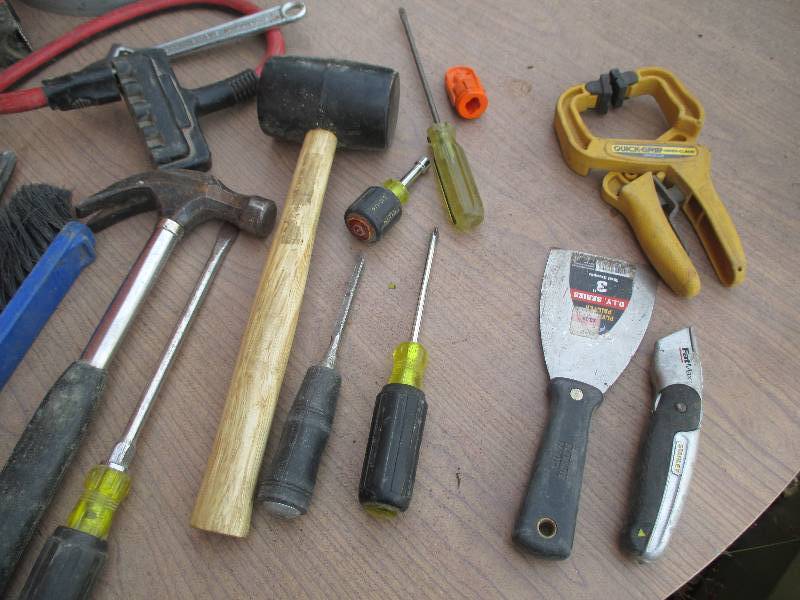 Bucket filled with tools and a divi...