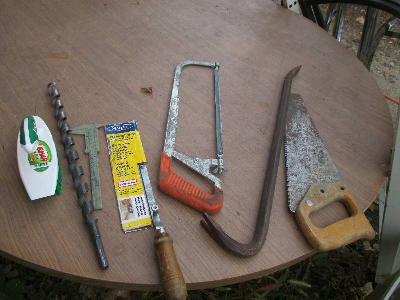 lot of saws and a long drill bit...