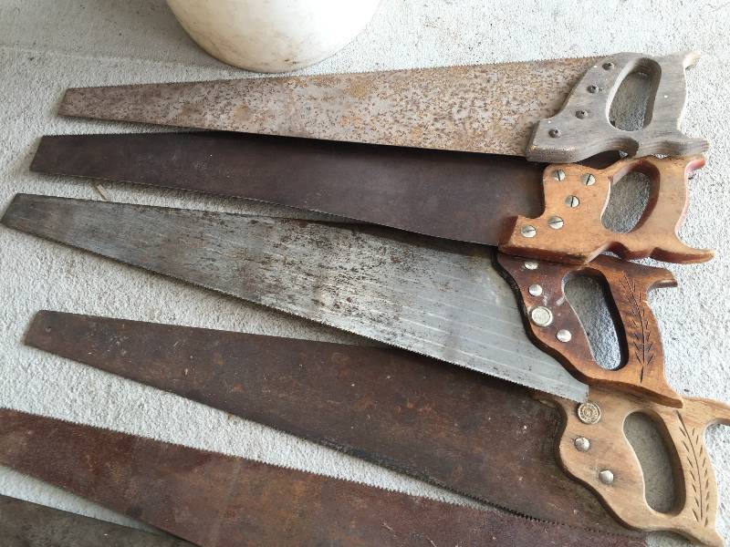 lot 22 image: Bucket full of hand saws
