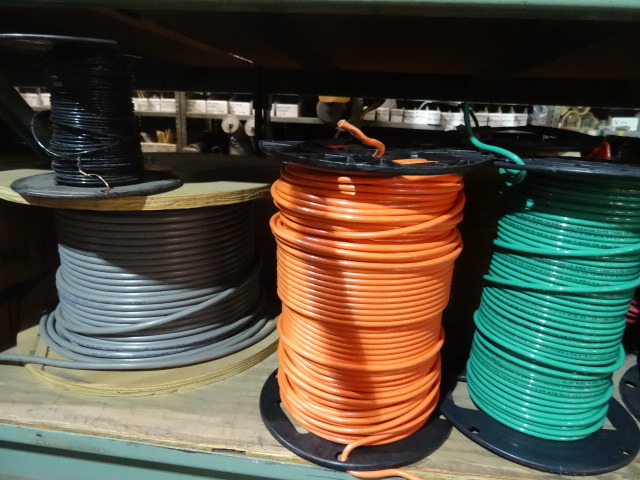 lot 113 image: Contents of Shelf. Rolls of Misc Wire