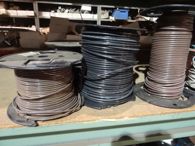 lot 114 image: Contents of Shelf. Rolls of Misc Wire