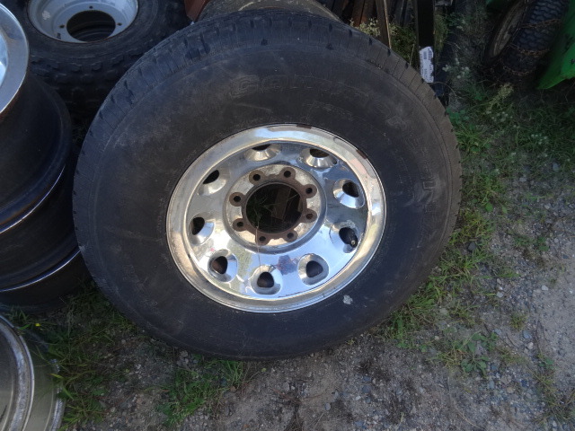 lot 12 image: 4 Steel Rims Off A Ford Super Duty Truck 1 Tire 75R16  1231200