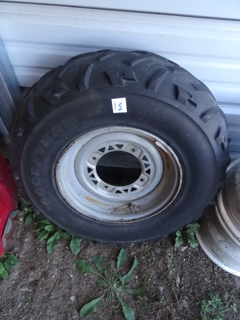 lot 15 image: 2 Rims and Tires Off Polaris Sportsman