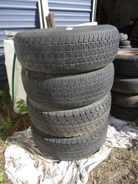 lot 62 image: Tires and Rims Off A Ford Explorer