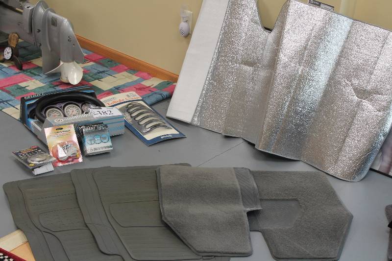 lot 382 image: Lot of (10) Miscellaneous Car Accessories Including Steering Wheel Horn Steering Wheel Cover And More.