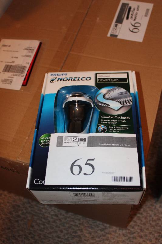 lot 65 image: Philips Norelco Electric Razor.