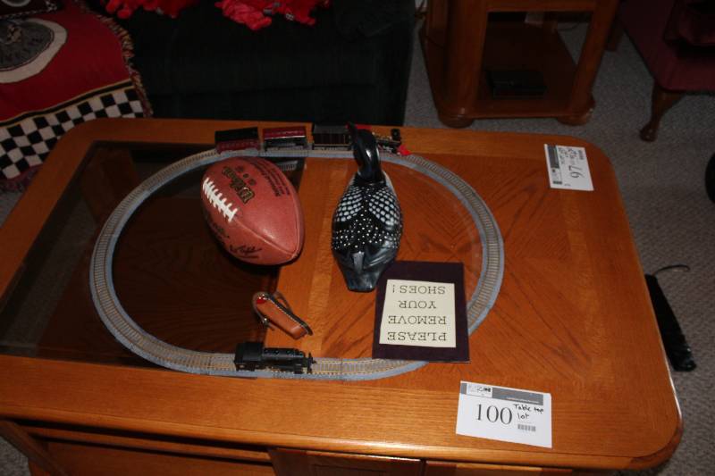 lot 100 image: Table Top Lot Including Loon Decoration Train Track Football And more.